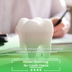 A tooth model sitting on top of a desk representing dental financing No Credit Check
