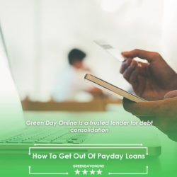 A person holding a credit card and using a laptop to learn how to get out of payday loans