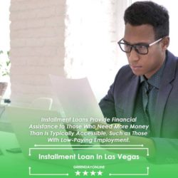 A man sitting at a desk in front of a laptop computer reading about installment loan in Las Vegas