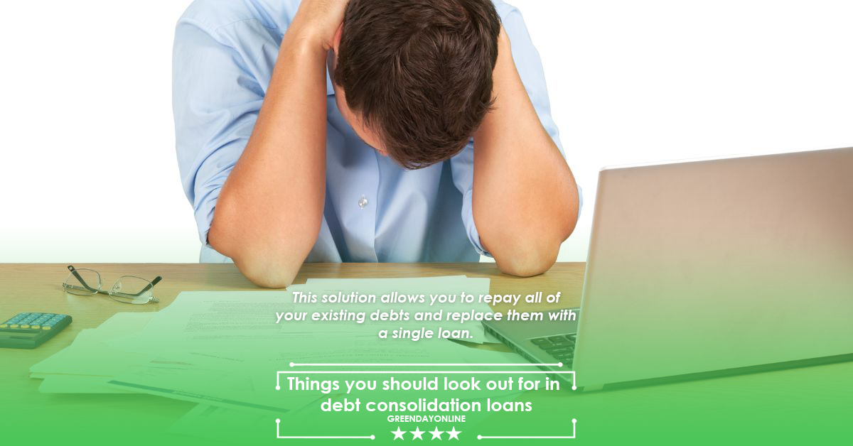 A man sitting at a desk with his head in his hands overthinking the things you should look out for in debt consolidation loans