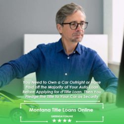 A man searching for Montana title loans online at a desk in front of a computer