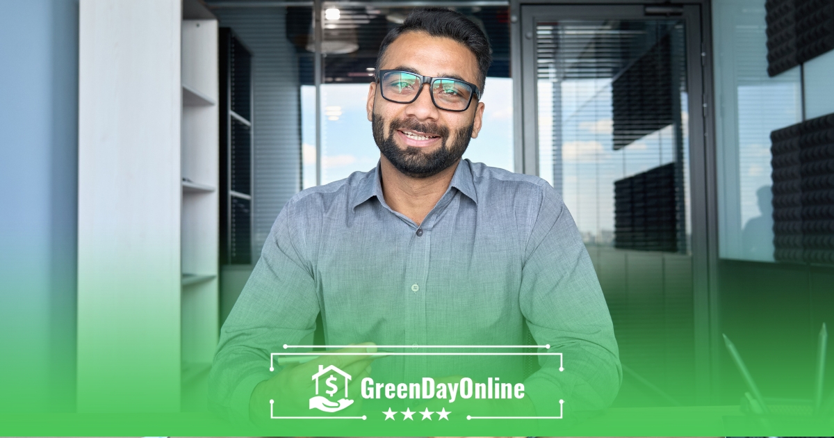 A man with glasses sitting in front of a glass exploring if one can get a payday loan in someone else’s name