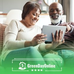 A man and woman sitting on a couch looking at a tablet searching for credit options from lenders